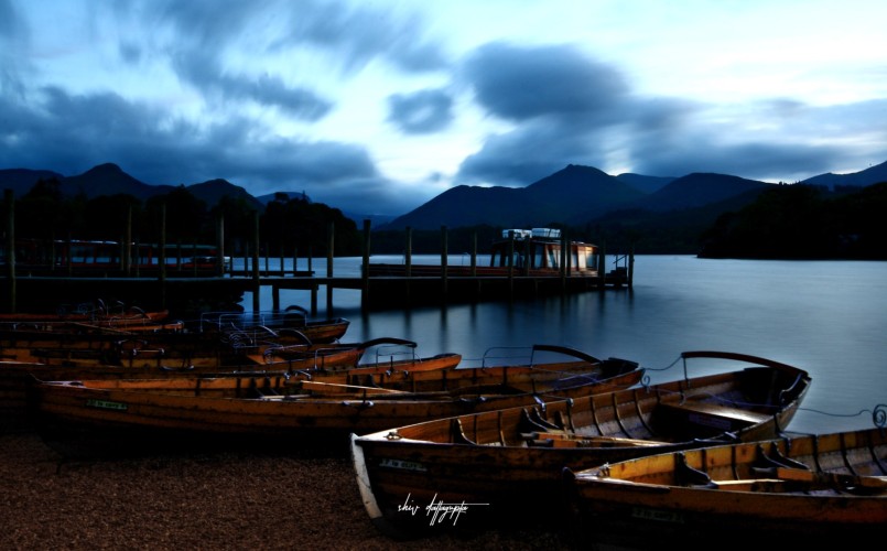 In frame - Lake Derwentwater right after sunset. Probably one of my most favorite photographs till date. A six second long exposure was used to capture the dramatic cotton clouds leisurely floating over the lake and some subtle reflection of the pier.